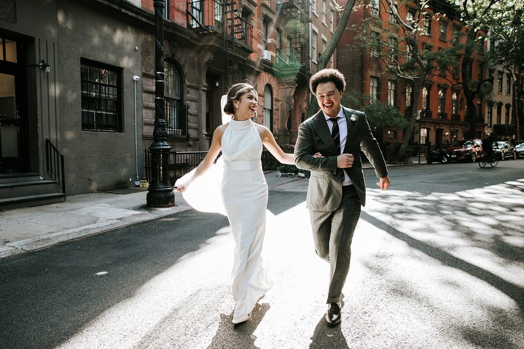 Couple runs through the streets of NYC after their elopement.