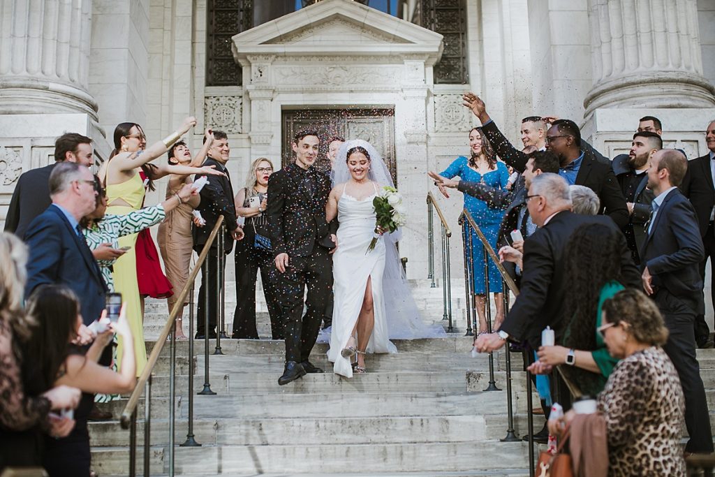Couple gets married in intimate micro-wedding on the steps of the New York Public Library (NYPL).