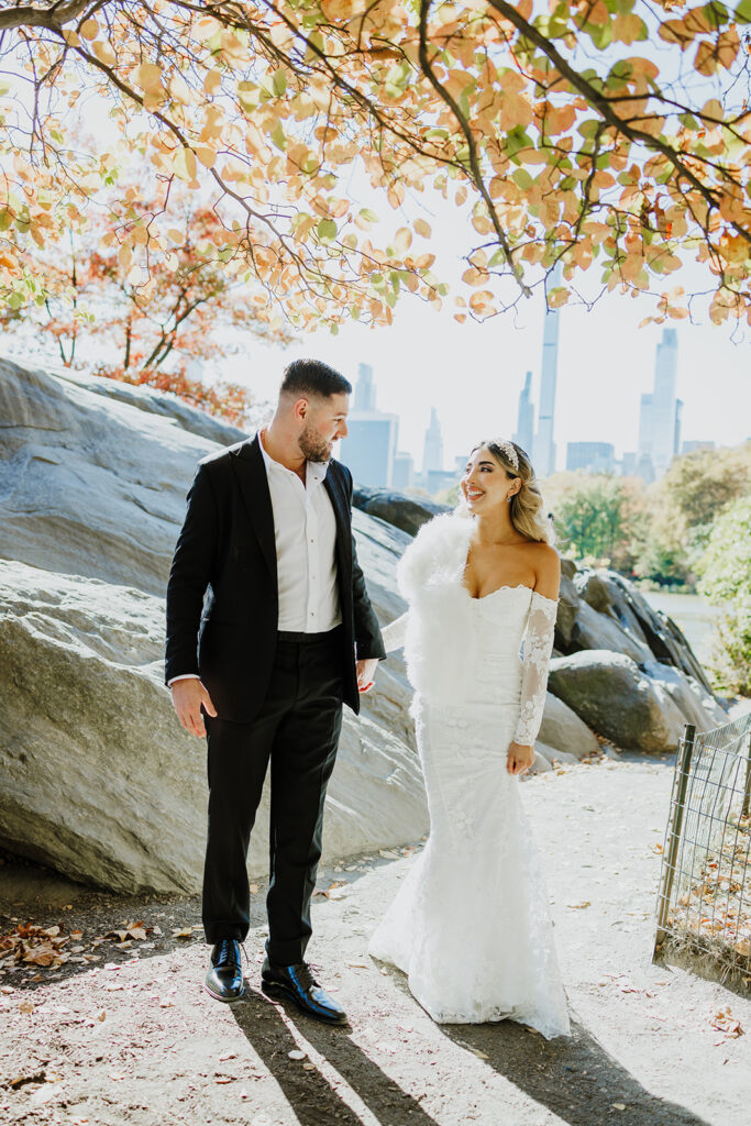 Couple elopes in Central Park during the autumn season.