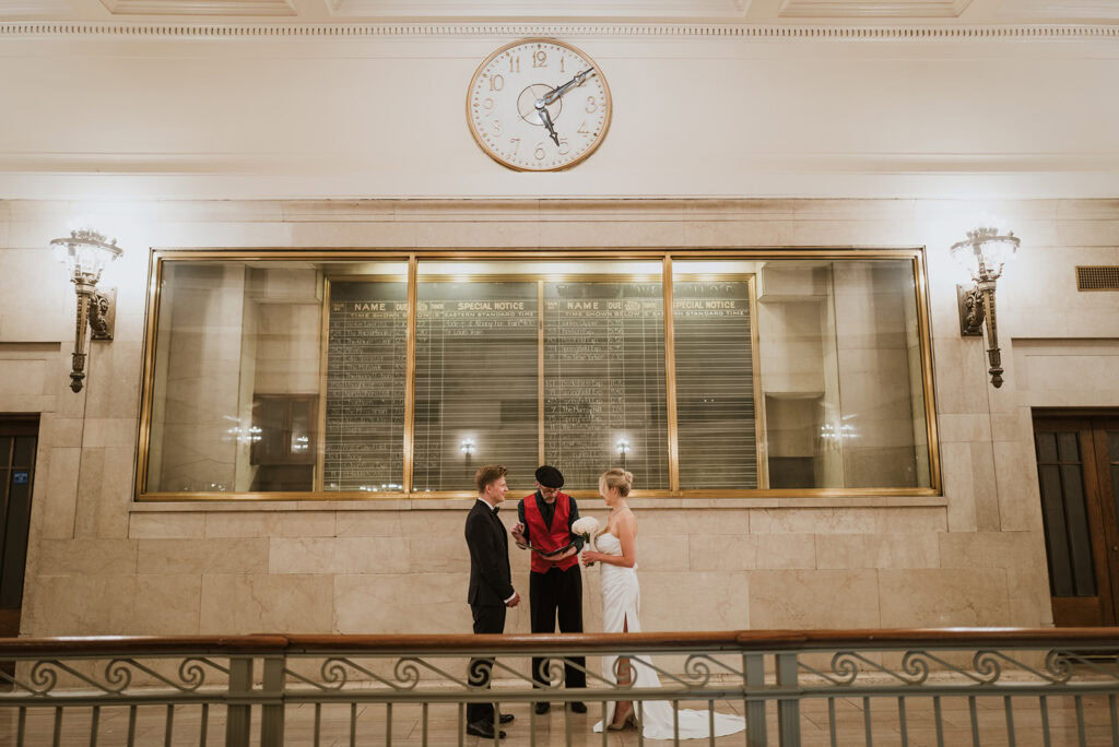 Couple elopes on the balcony of Grand Central Terminal in NYC.