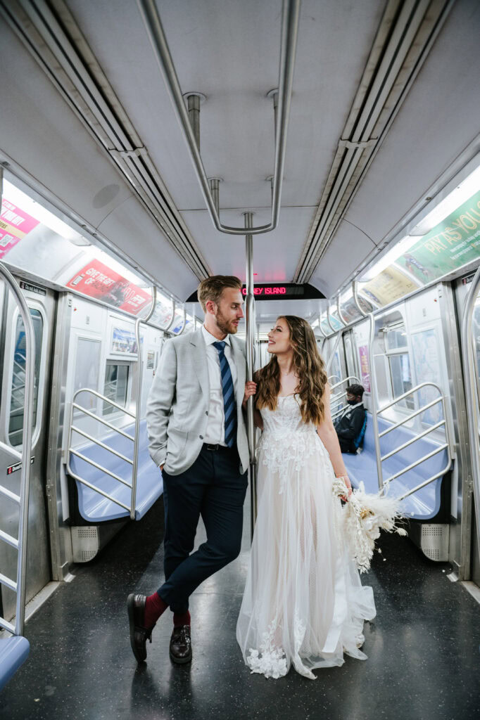 Newlyweds ride the subway after their NYC elopement.