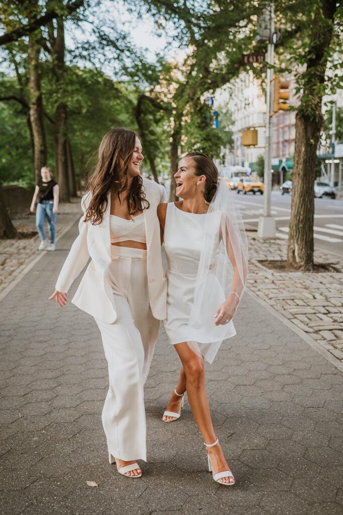 Two brides walk whimsically through NYC.