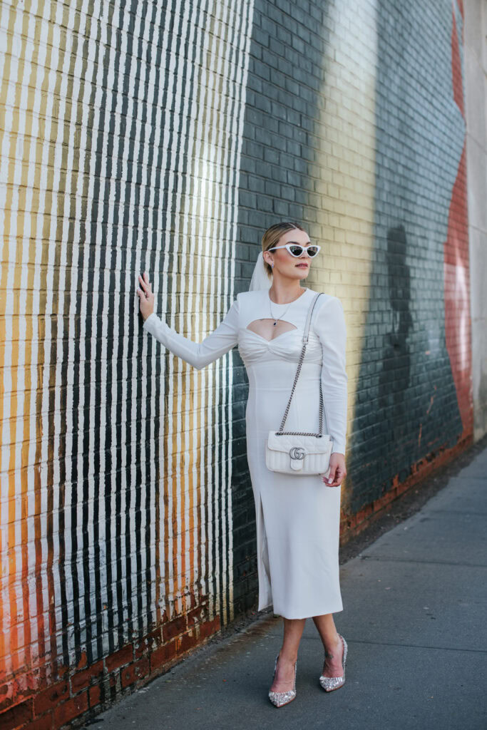 Stylish bride wears rhinestone covered stilettos, a veil, and vintage sunglasses at her DUMBO elopement in NYC.
