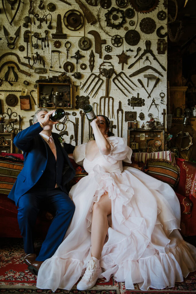 couple drinks champagne and throws cake at nyc elopement