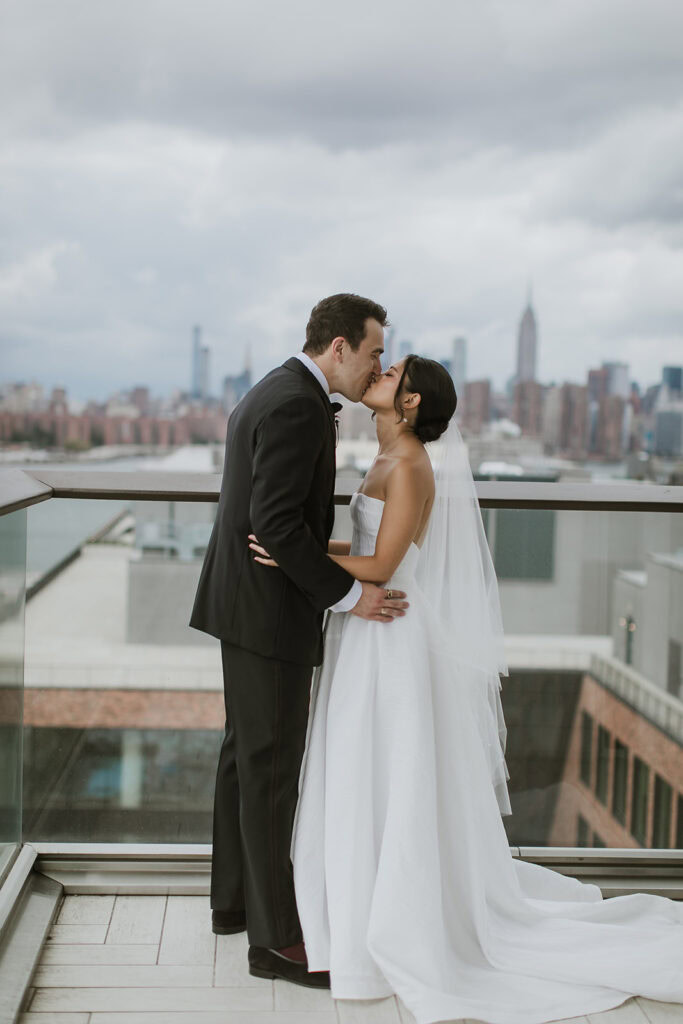 Couple celebrates their elopement on the balcony of The Willam Vale Hotel in Brooklyn.